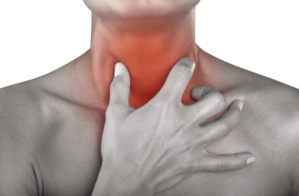 Traveler holding their neck with a sore throat